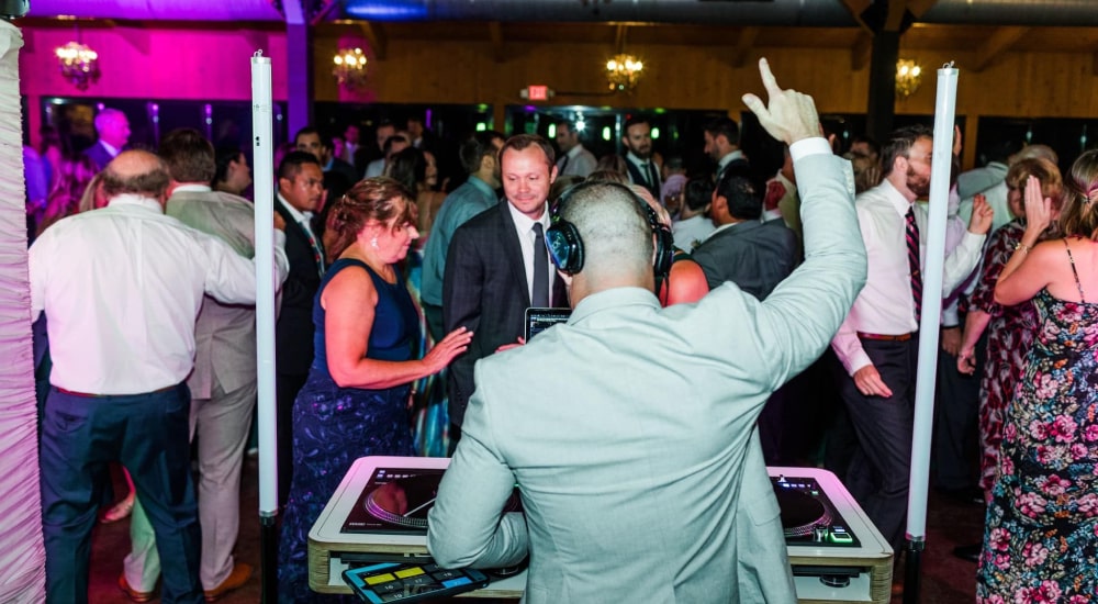Klock Entertainment Harrisburg Wedding DJ featuring DJ playing music to wedding reception