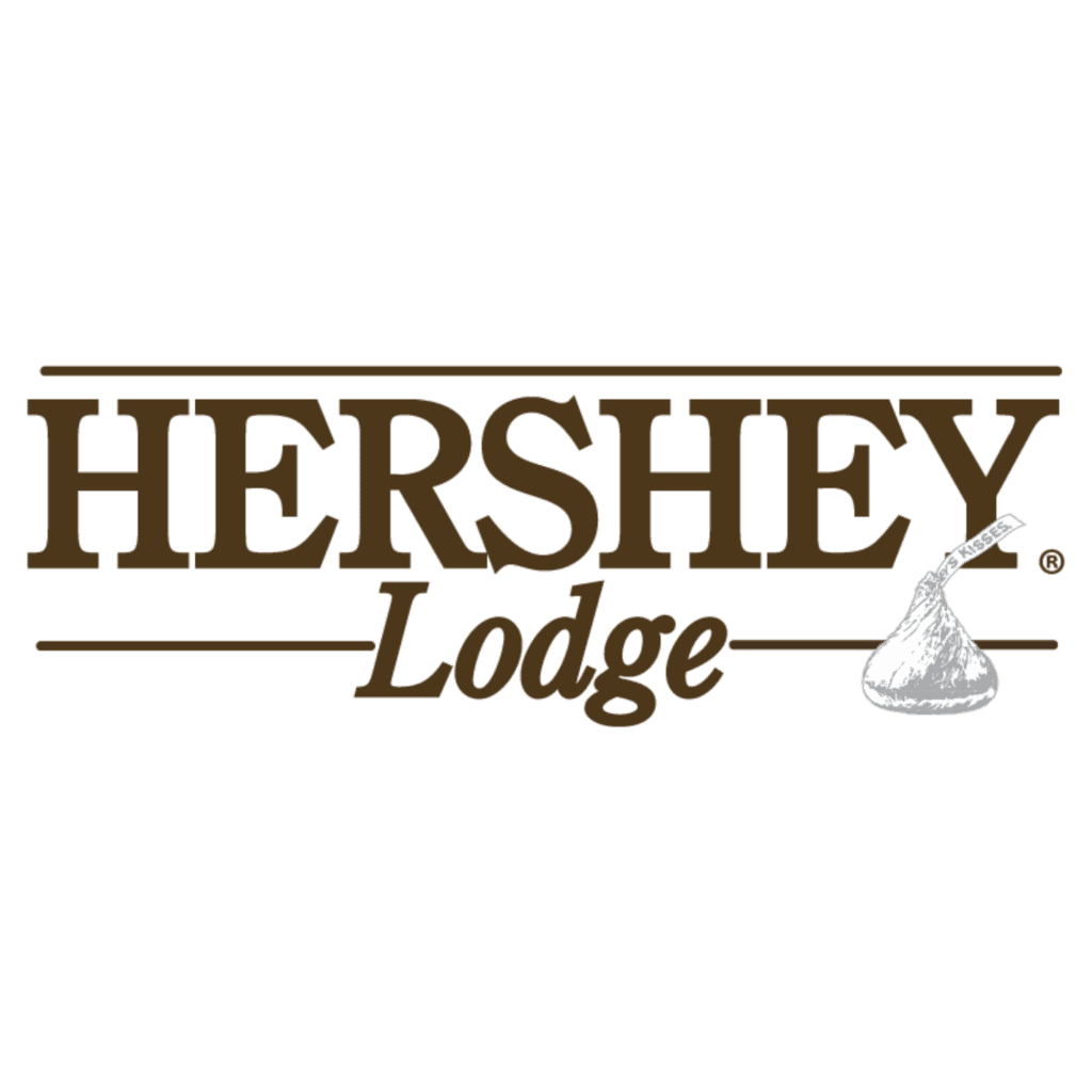 Hershey Lodge logo in brown letters with a stylized Hershey’s Kiss chocolate icon to the right of the word “Lodge.”.