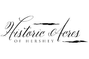 Historic Acres of Hershey" logo in elegant, black cursive and serif font on a white background.