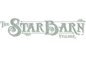 Logo for The Star Barn Village featuring ornate, decorative lettering in a light gray-green color on a white background.