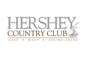 venue-logo-hershey-country-club Logo for Hershey Country Club with text "Hershey Country Club" and "East • West • Spring Creek" alongside a Hershey’s Kiss icon.