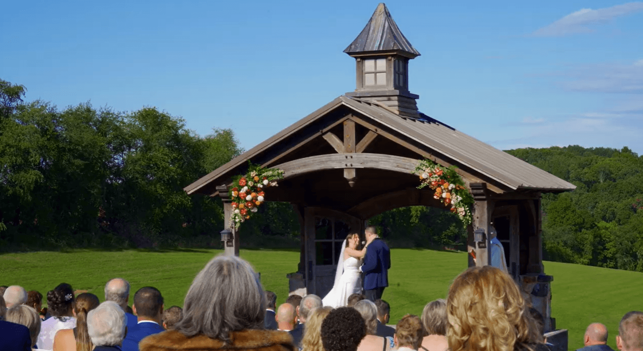 Outdoor wedding ceremony at Wyndridge Farm in Dallastown, PA, with Klock Entertainment providing ceremony sound